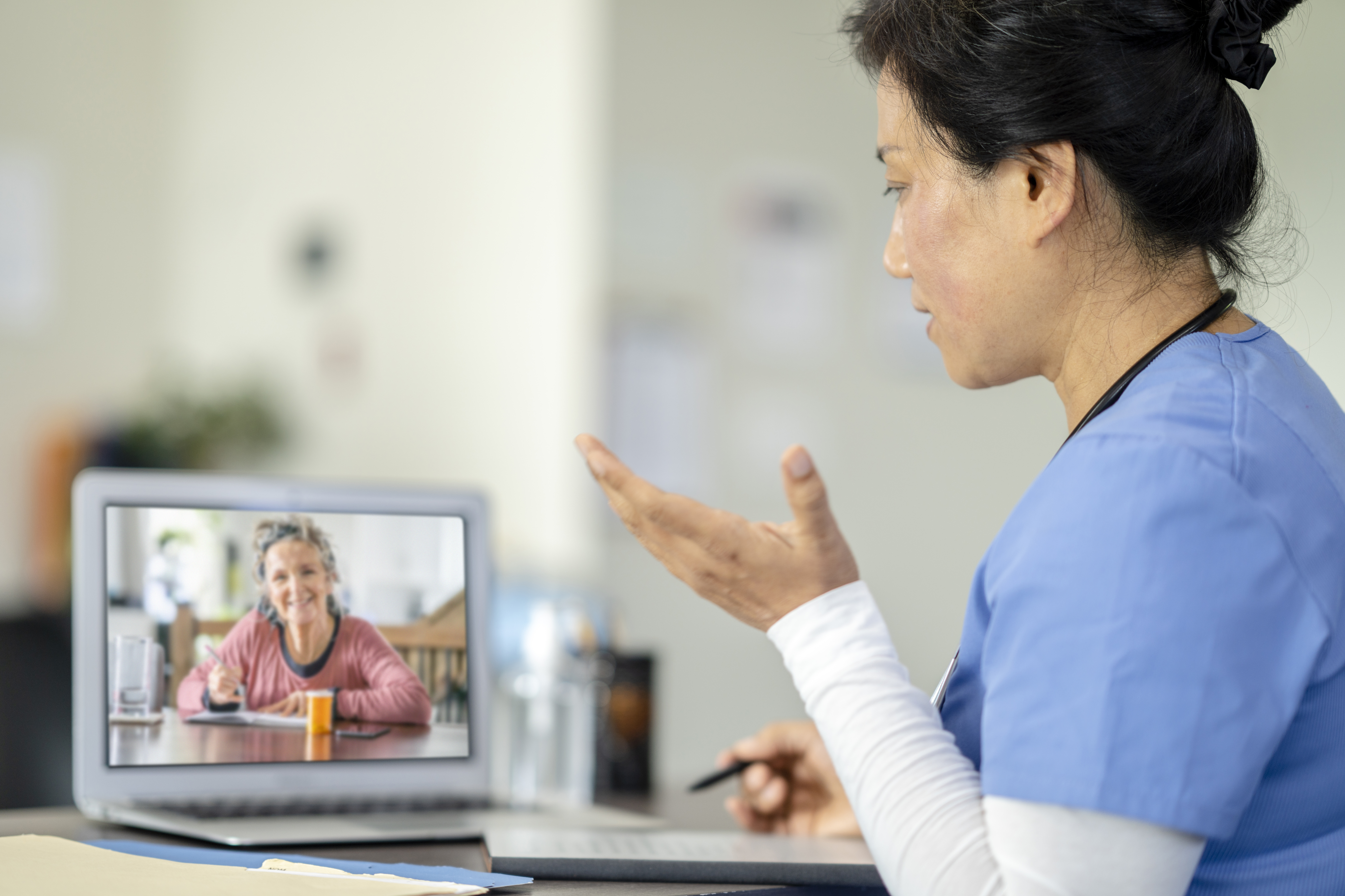 Female doctor on a telemedicine call with a patient