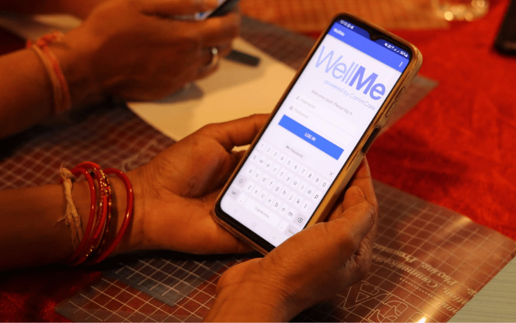 A frontline worker using the WellMe resilience app and informing design and development through the Frontline Worker (FLW) Advisory Panel—a platform that places frontline workers at the heart of digital innovation.