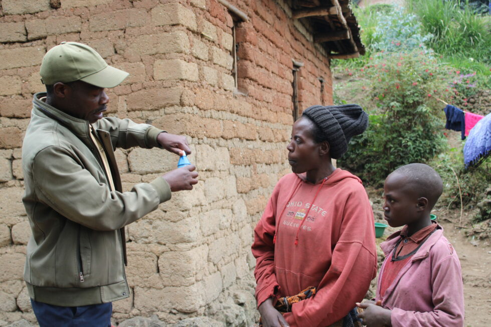 Damascene-Move-Up-Global-Community-Health-Worker-Demonstrating-the-use-of-Sur-Eau-for-Water-Chlorination-scaled-1-980x653